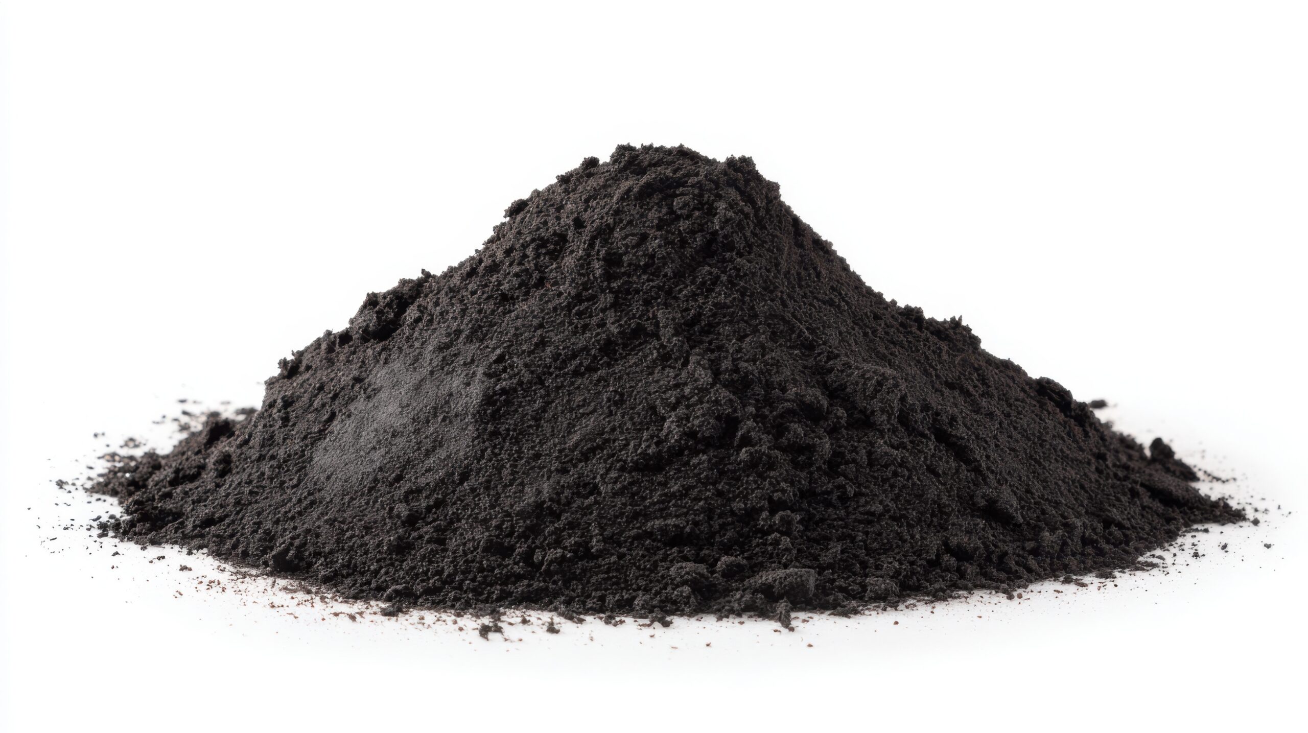 Close-up image of a mound of black powder on a white background, showcasing its fine texture and dark color, commonly used in various industrial and artistic applications.