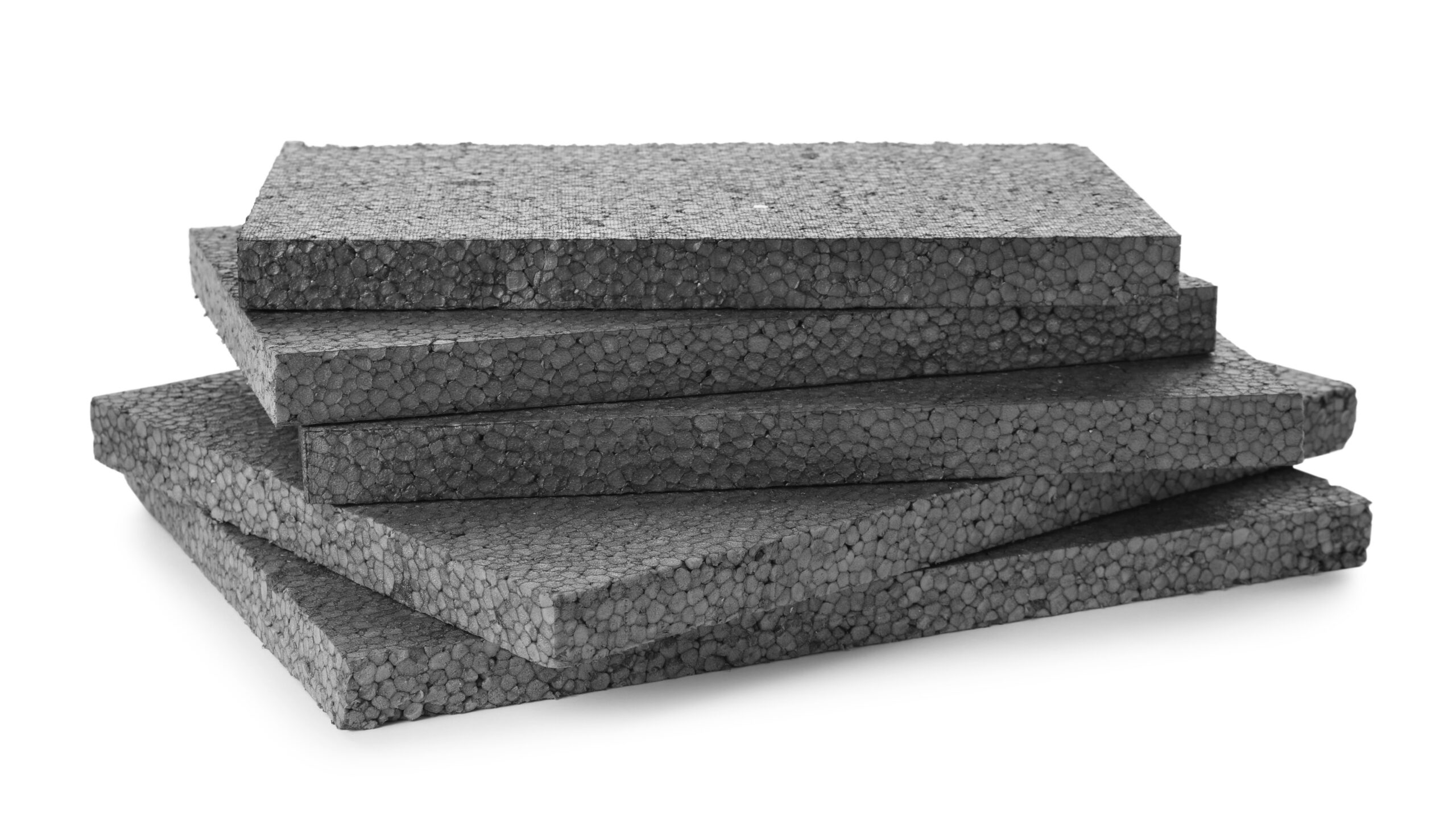 Stack of gray foam boards showcasing a textured surface, ideal for insulation and crafting projects.