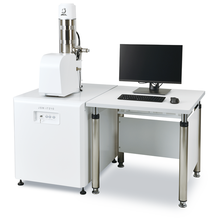Scanning electron microscope setup with JSM-IT210 model, featuring a computer monitor, keyboard, and mouse on a white workstation, designed for high-resolution imaging and analysis in scientific research.
